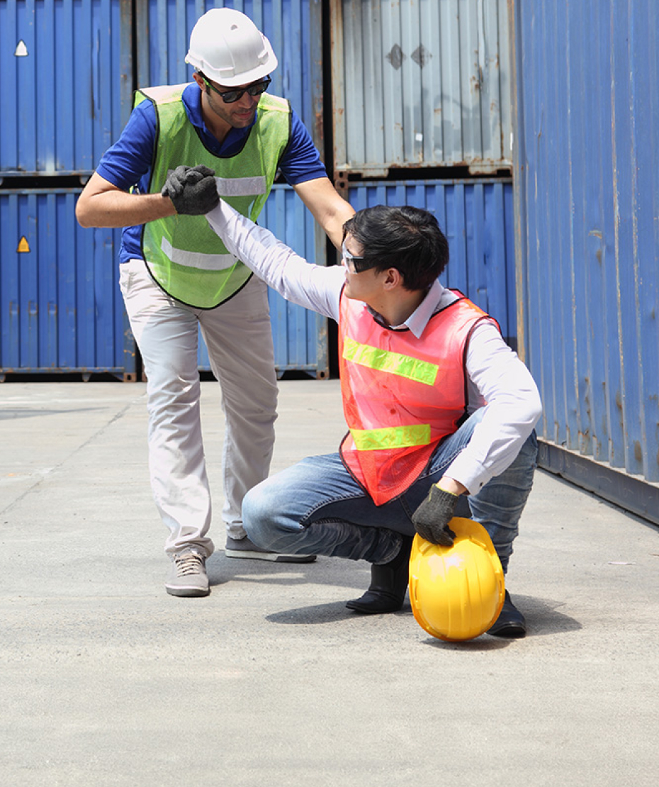 construction workers surrounded by shipping containers