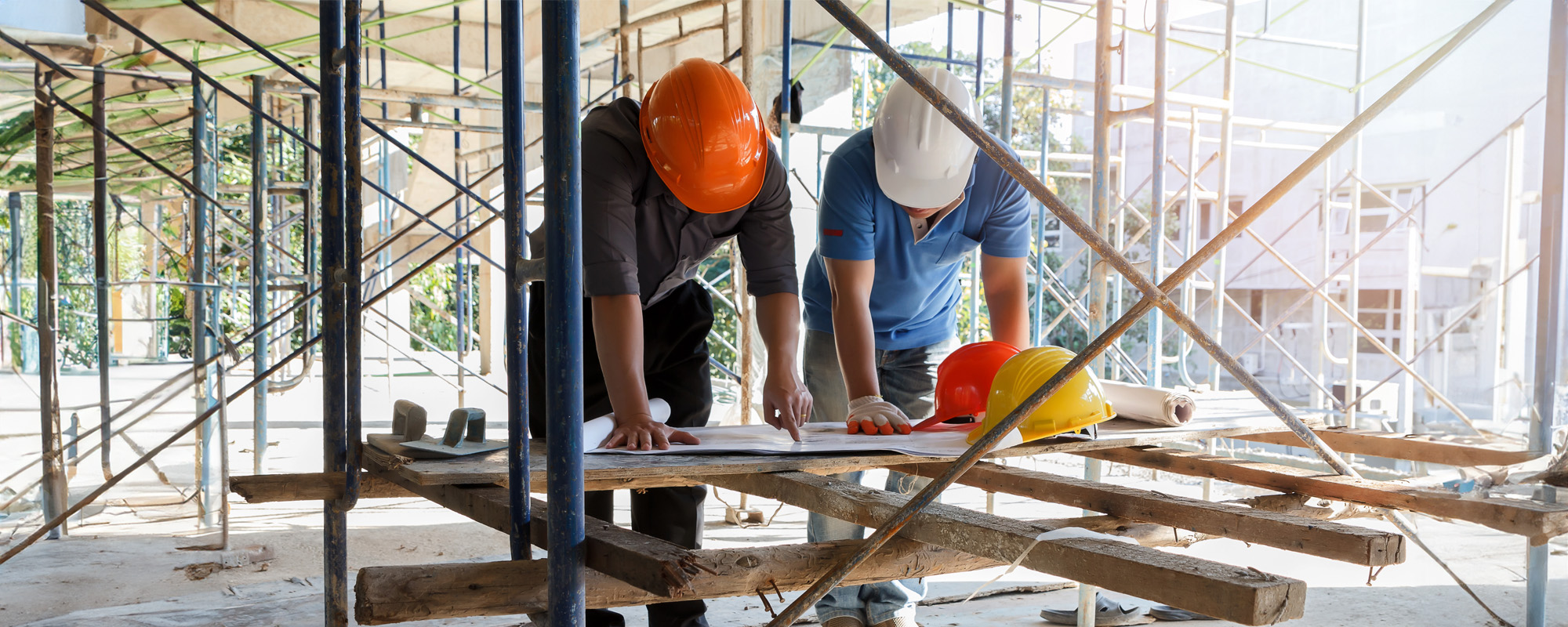 engineer discussing with foreman about project in building construction site