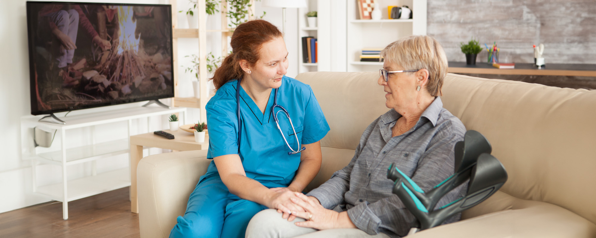 Female Nursing home technician speak with a senior resident; Orlando Nursing Home Abuse Lawyer concept image