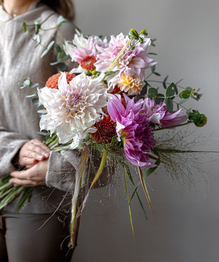 woman next to flowers