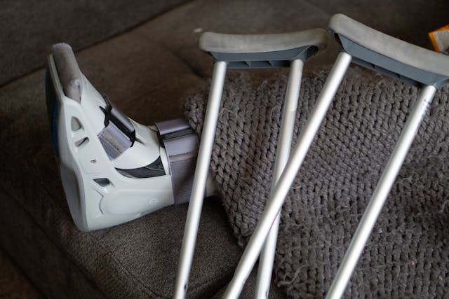 person with foot cast and crutches